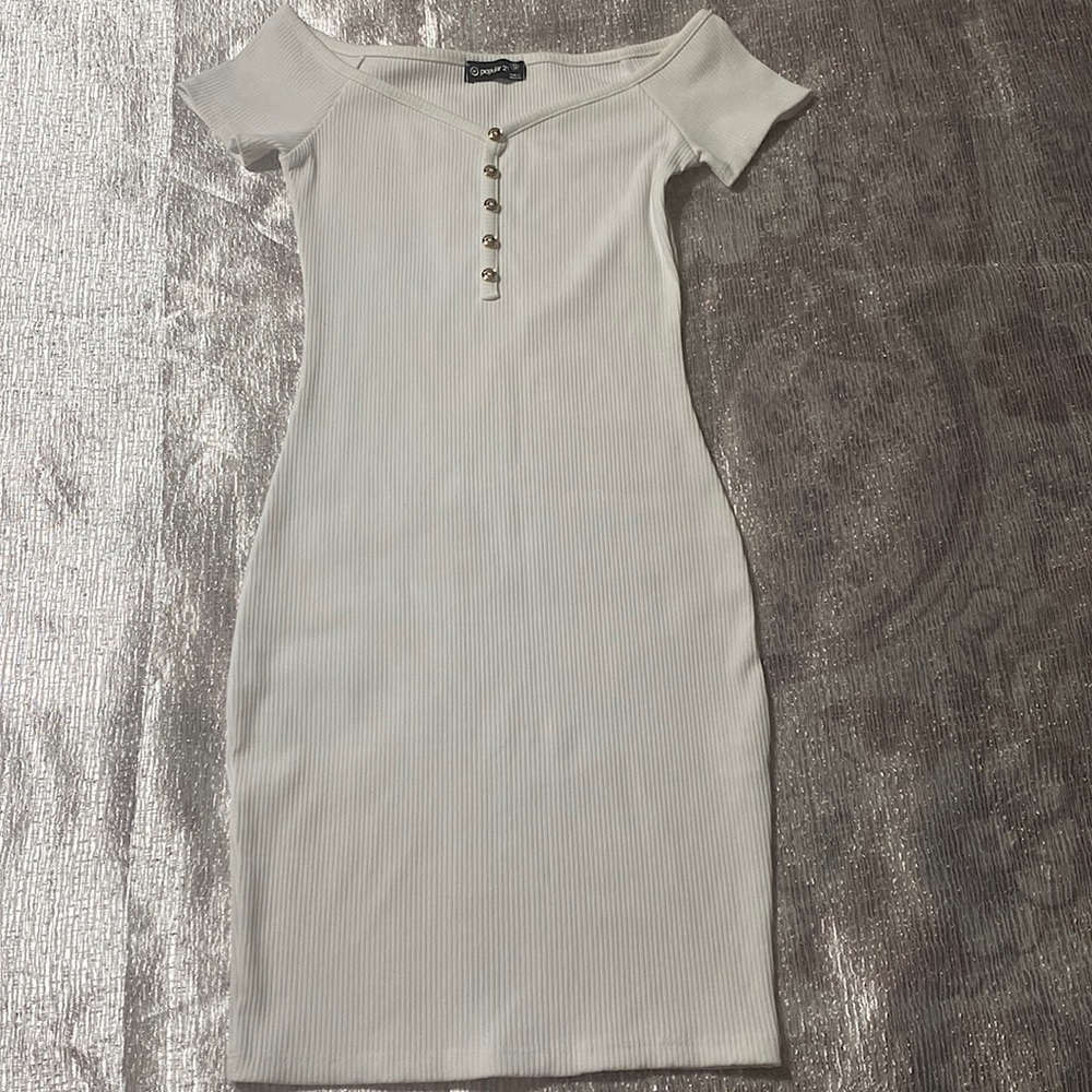 This is Popular 21 in size small with gold buttons and white dress.